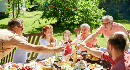 Photography leisure, holidays and people concept - happy family having festive dinner or sum