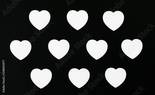 White hearts on a black background