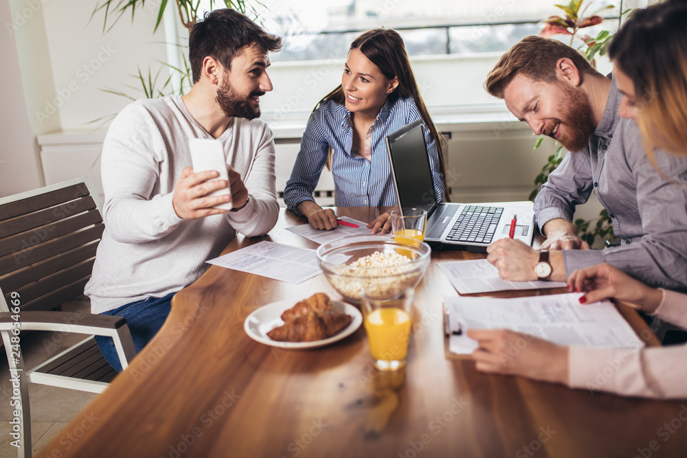 Successful start-up team in training. Business team working on marketing strategy. Brainstorming meeting concept. Successful start-up team in training. Business team working on marketing strategy. Brainstorming meeting concept.
