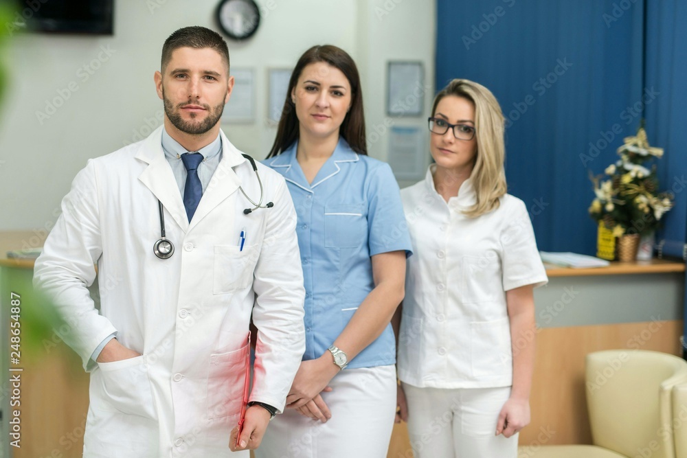 Male doctor and two female nurses inside a hospital, concept Male doctor and two female nurses inside a hospital, concept