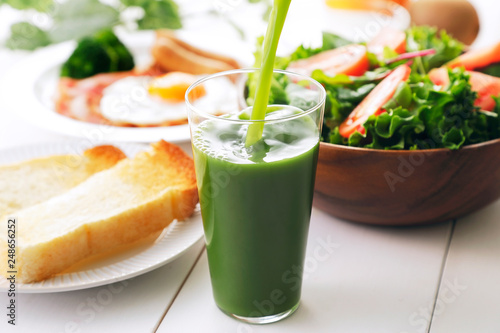                               Green juice and breakfast image