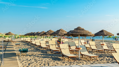 Photos Umbrellas and chaise lounges on the beach of Rimini in Italy..