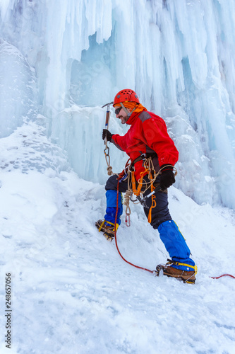ice climber climbing a glacier