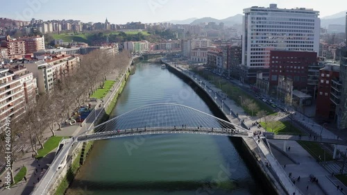 Aerial; drone view of Bilbao capital of Basque country; city panorama with modern architecture and contemporary art objects; new life of ancient city; the combination of old town and modern urbanism