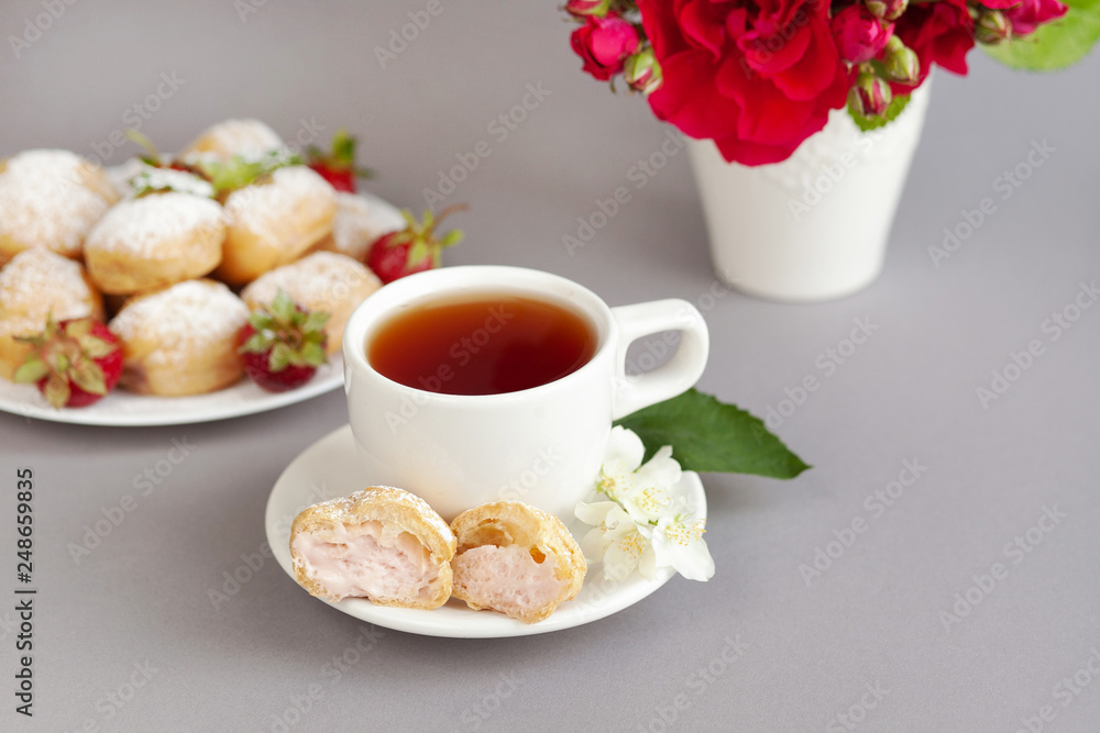 Home made cake eclairs. Traditional eclairs, profitroles classic, eclairs french. Background to Valentine's day, festive tea party. Food consept Home made cake eclairs. Traditional eclairs, profitroles classic, eclairs french. Background to Valentine's day, festive tea party. Food consept