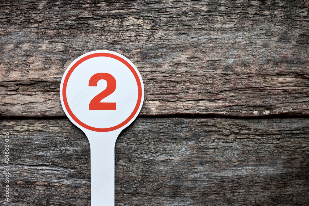 Plate number on a old wooden background. Numbers for lists or numbering concept. Plate number on a old wooden background. Numbers for lists or numbering concept.