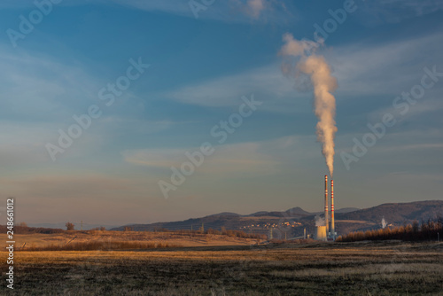 Factory in Usti nad Labem city from Milada lake in winter evening
