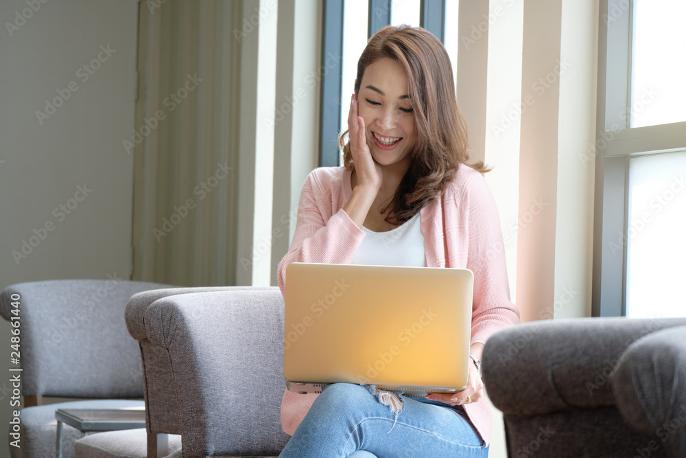 Young woman working online shopping using laptops and in a happy mood. Young woman working online shopping using laptops and in a happy mood.