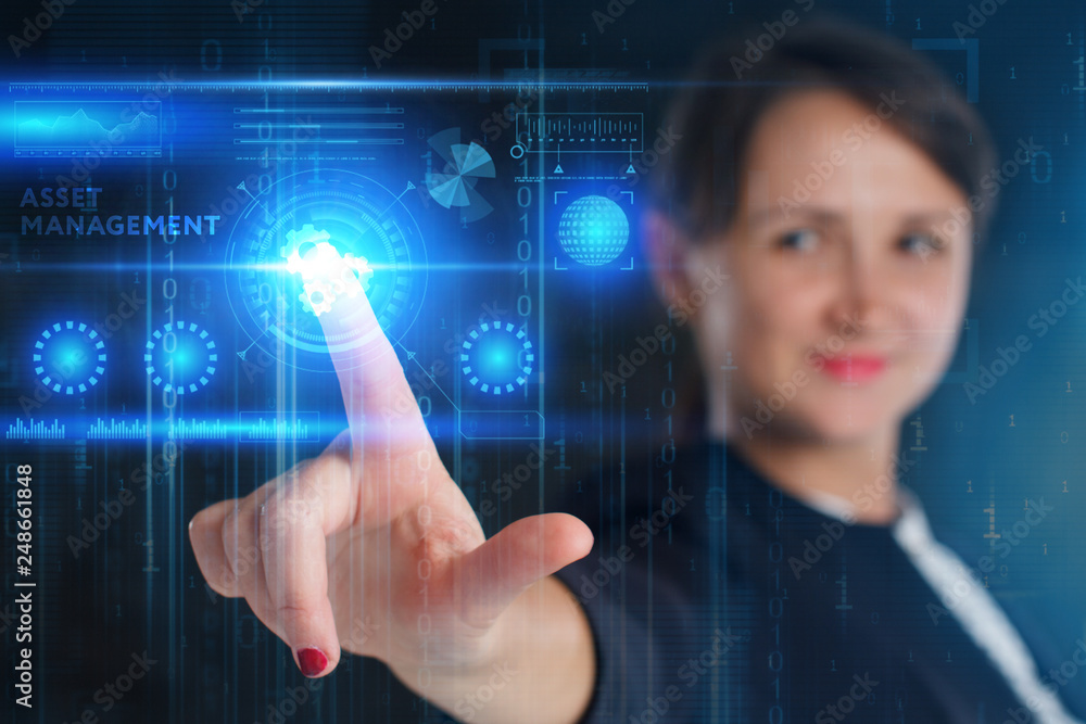 The concept of business, technology, the Internet and the network. A young entrepreneur working on a virtual screen of the future and sees the inscription: Asset management The concept of business, technology, the Internet and the network. A young entrepreneur working on a virtual screen of the future and sees the inscription: Asset management