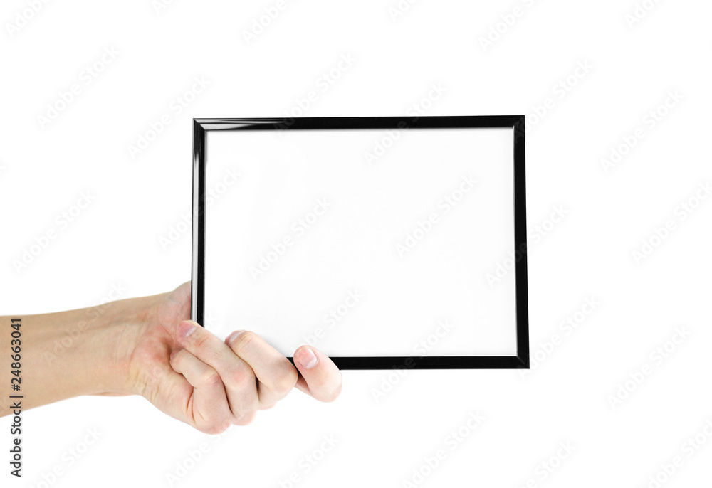 Hand holding black photo frame. Close up. Isolated on white background Hand holding black photo frame. Close up. Isolated on white background