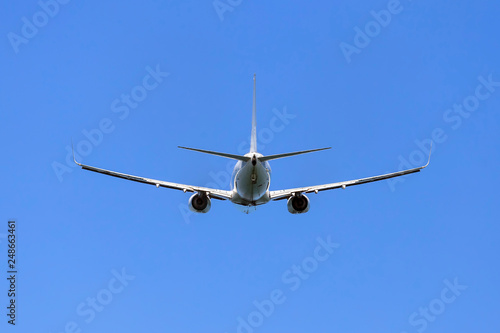 Aircraft with landing gear on the background of the sky