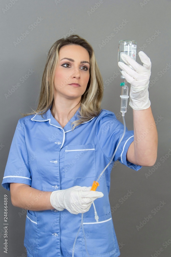 Female nurse on grey background, isolated Female nurse on grey background, isolated