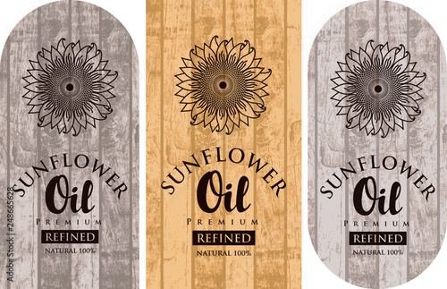 Set of three vector labels for refined sunflower oil with sunflowers and inscriptions on wooden background