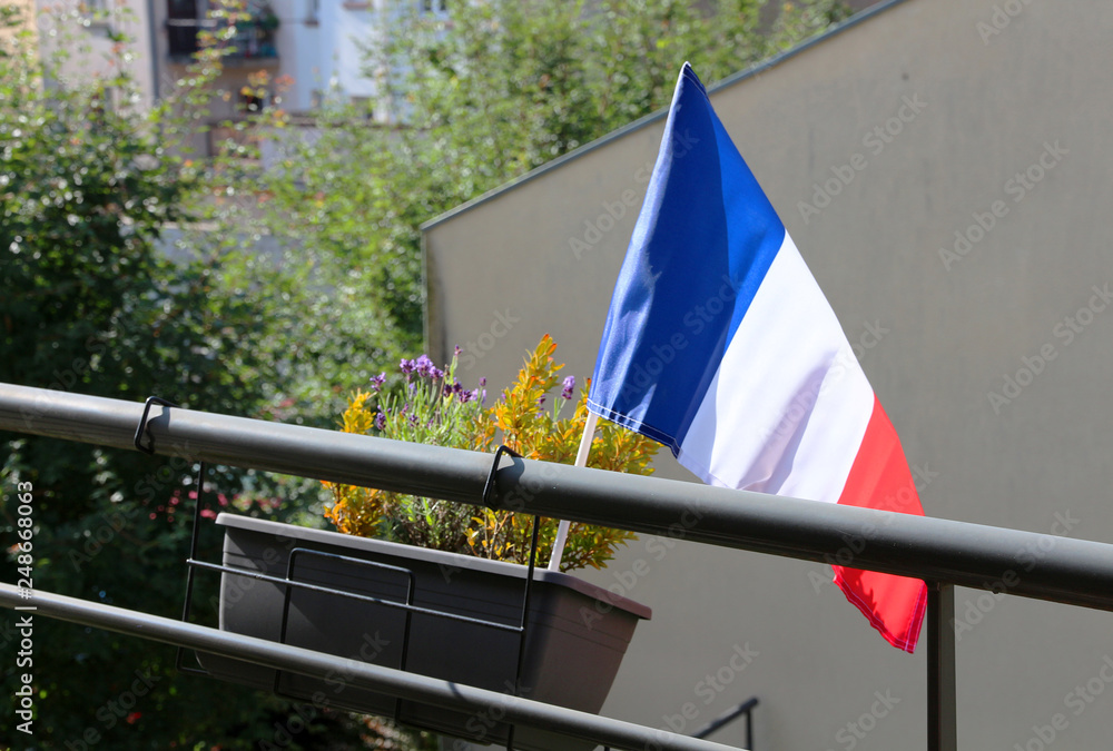 small french flag on a balcony