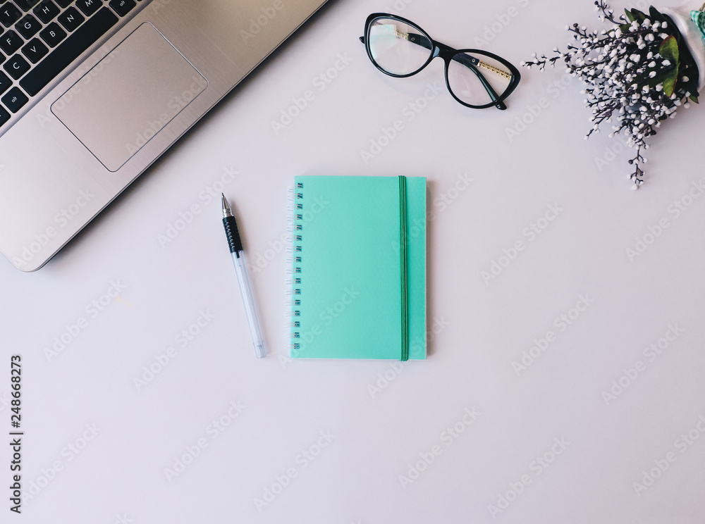 Home office workspace mockup.Workspace top view, copy space.White desk office with blank notebook, computer and other office supplies. Flat lay, top view office table desk.Minmal workspace. Home office workspace mockup.Workspace top view, copy space.White desk office with blank notebook, computer and other office supplies. Flat lay, top view office table desk.Minmal workspace.