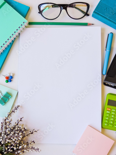 Home office workspace mockup.Workspace top view, copy space.White desk office with blank notebook, computer and other office supplies. Flat lay, top view office table desk.Minmal workspace.