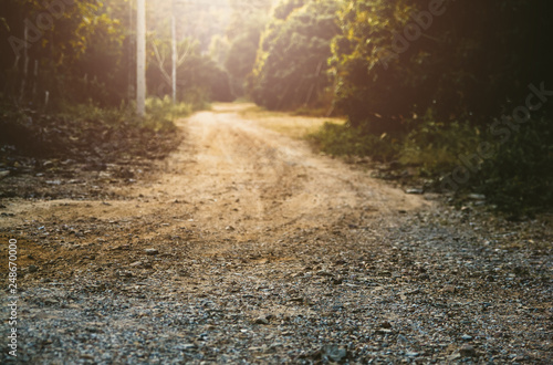 red  gravel road landscape empty countryside. in  forest area photo