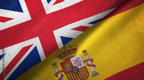 United Kingdom and Spain two flags textile cloth, fabric texture