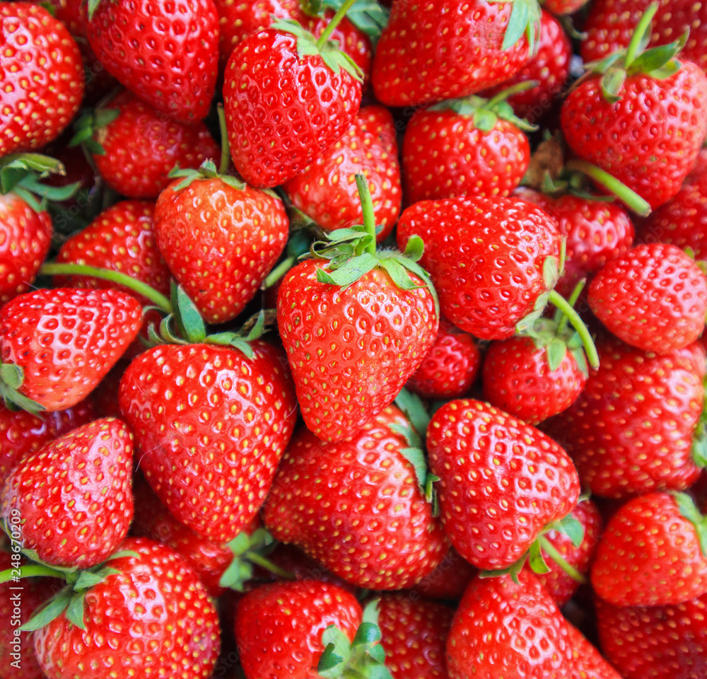 Plakat Fresh organic red ripe Strawberry fruit background Top view closeup