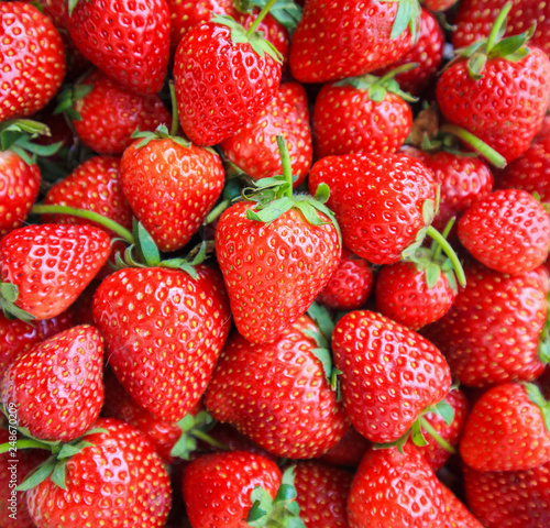 Fresh organic red ripe Strawberry fruit background Top view closeup