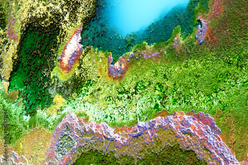 Multicolored mineral stratum on river photo