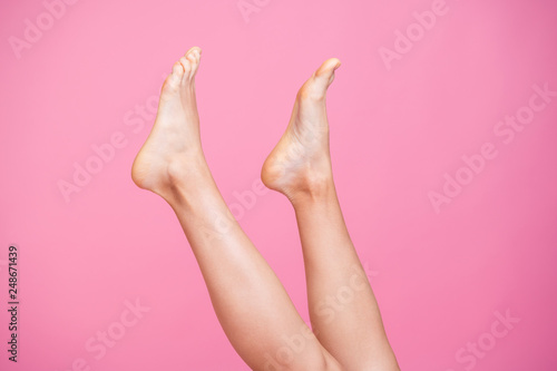Cropped close-up image view photo of feminine fit thin slim legs ad advert healthy lifestyle care isolated over pink pastel background © deagreez