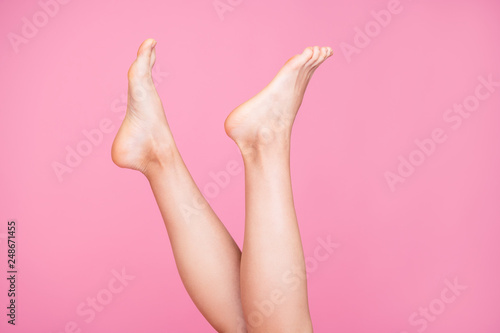 Cropped close-up image view photo of nice feminine fit thin slim legs ad advert healthy lifestyle active moving life isolated over pink pastel background © deagreez