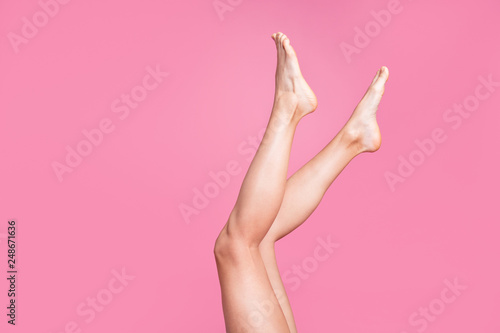 Cropped image view photo of nice long attractive feminine fit thin slim soft smooth shine clear clean shaven legs ad advert isolated over pink pastel background
