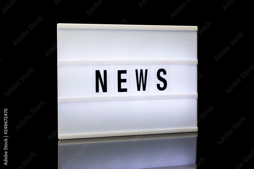 NEWS, word written on lightbox NEWS, word written on lightbox
