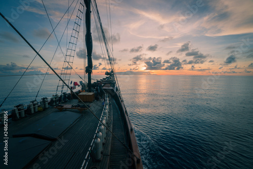Sailboat at sea with sunset