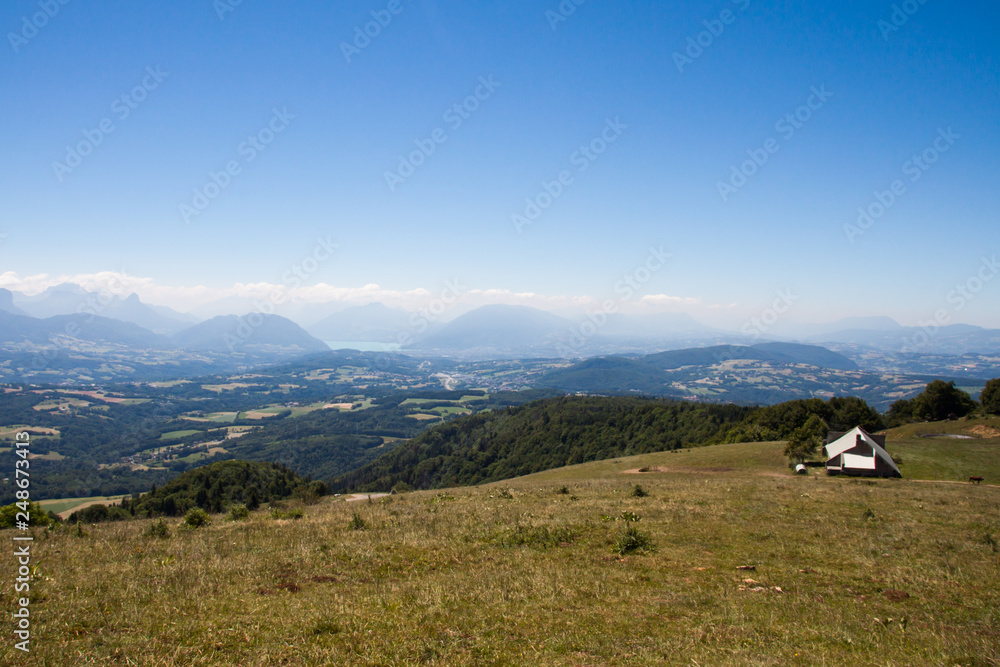 Altitude Panorama over Annecy Lake and French  Haute Savoie Valley with Barn on a Sunny Summer Day