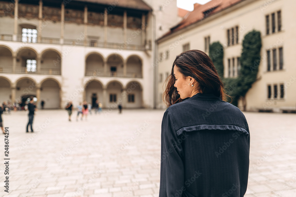 Fototapeta premium Pretty pan asian tourist girl walking in the tourist place outdoor.
