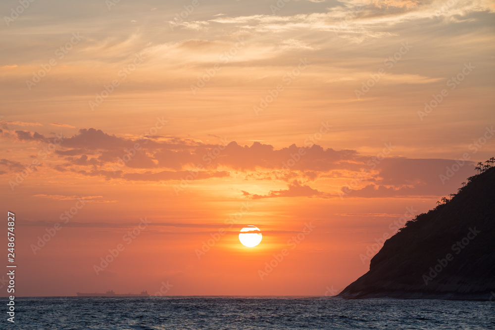 beautiful sunset on the beach of itacoatiara in niterói, rio de janeiro, brazil beautiful sunset on the beach of itacoatiara in niterói, rio de janeiro, brazil