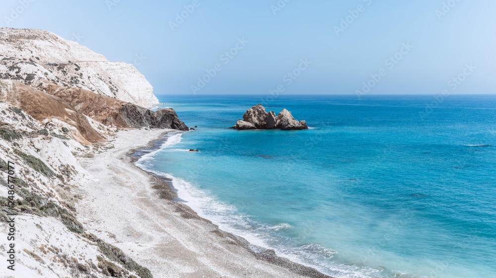 View of the blue sea with rocks and wild beaches.