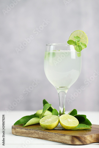 Lime juice, limes slice with mint leaves on table, Fresh drink lemonade.