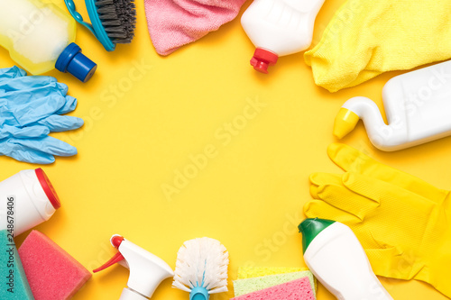 Cleaning concept. Assorted supplies frame. Choose and buy. Copy space on yellow background.