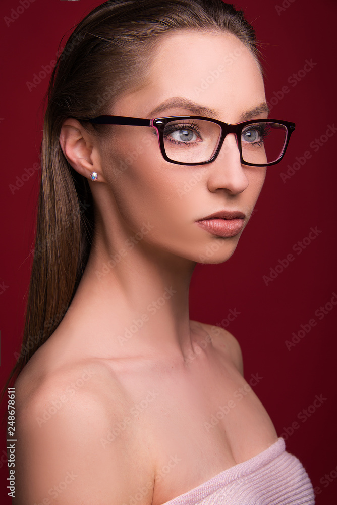 beautiful portrait girl model with eyeglasses red frame beauty shoot blue eyes
