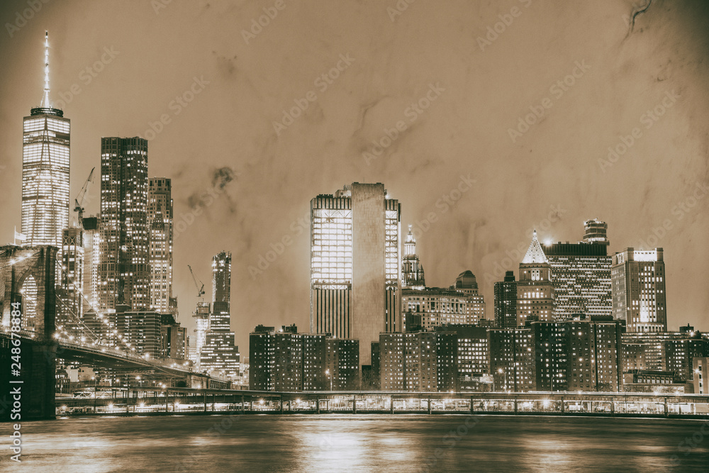 Night view of Brooklyn Bridge and Manhattan skyline from Brooklyn Bridge Park. Long exposure