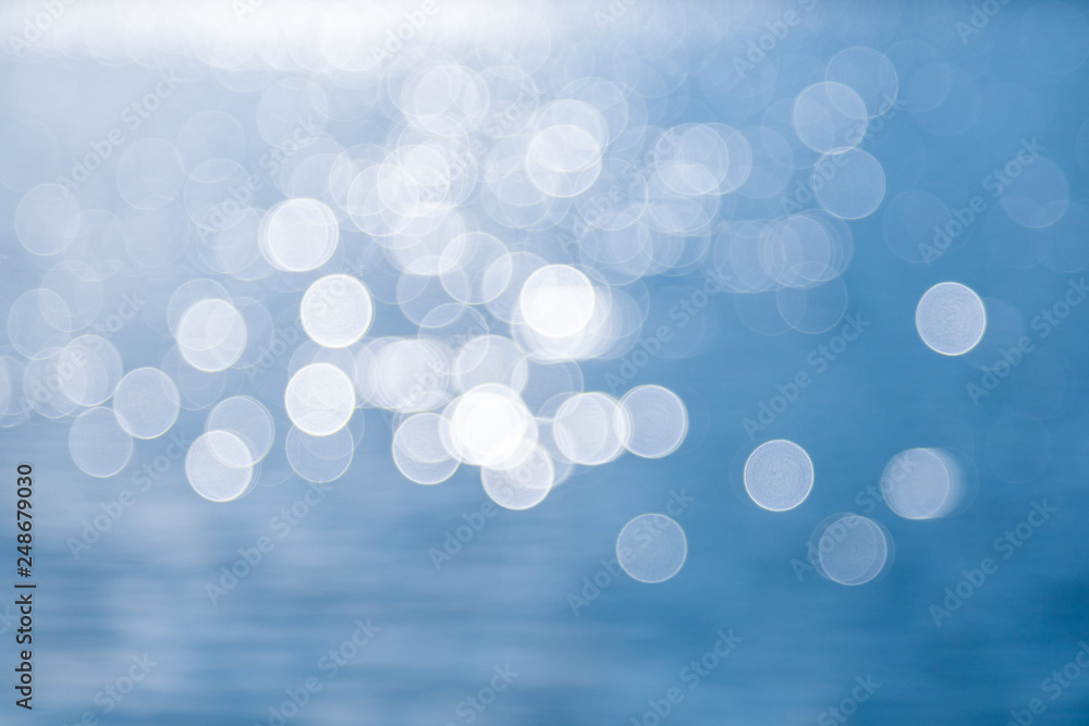 Blurry scene of light and blue water Blurry scene of light and blue water