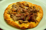 Buryan (lamb slow-cooked in a pit) served on a flat bread