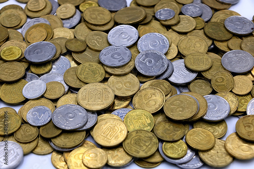 Ukrainian hryvnia. Money coins close up on a light background. Main focus on center photo