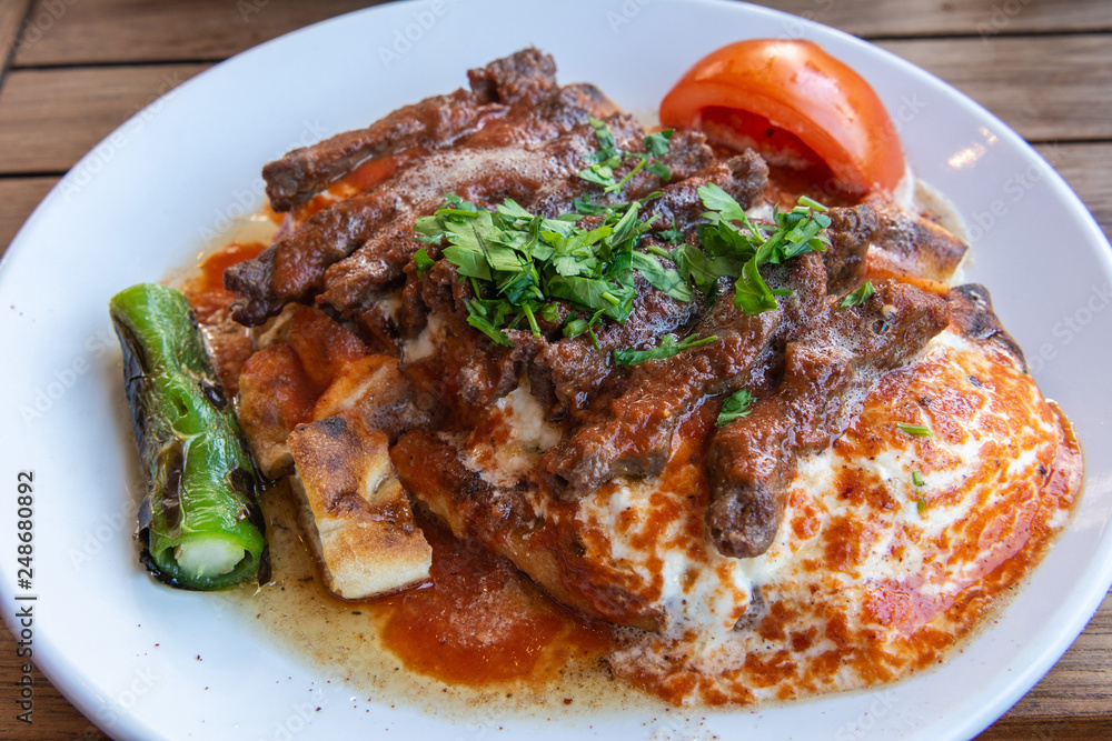 Turkish manisa kebap served on pita bread Turkish manisa kebap served on pita bread