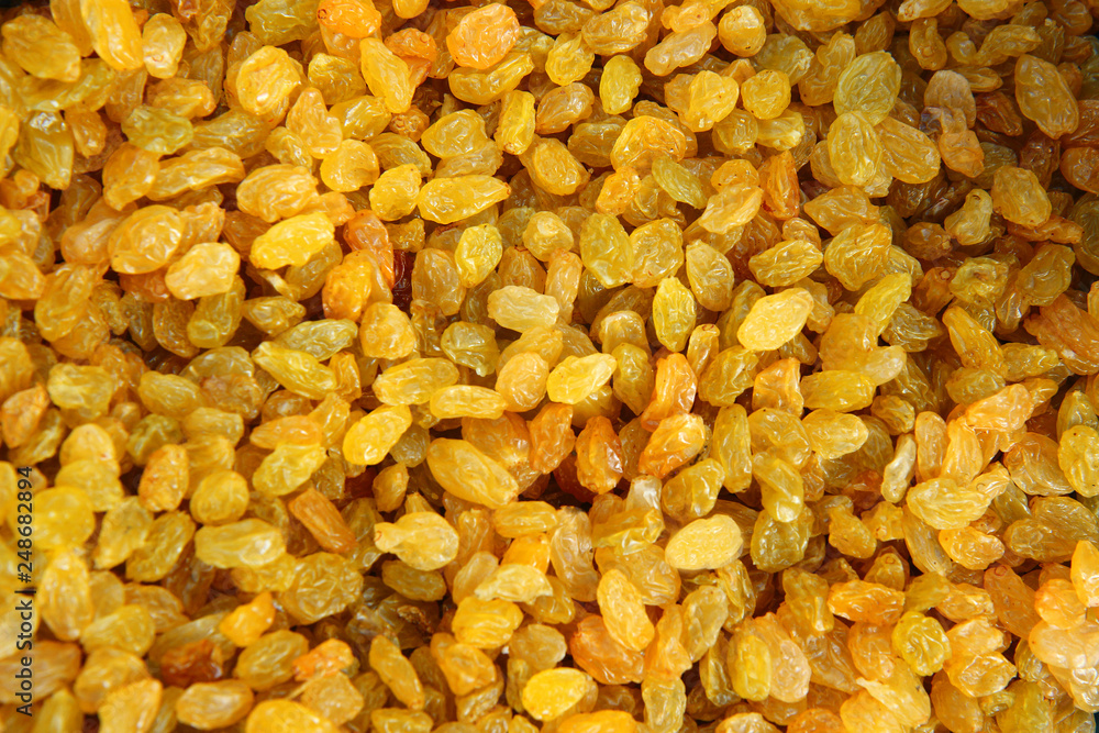 Raisins are beautifully decomposed, yellow is the highest grade. Delicious background or wallpaper Raisins are beautifully decomposed, yellow is the highest grade. Delicious background or wallpaper