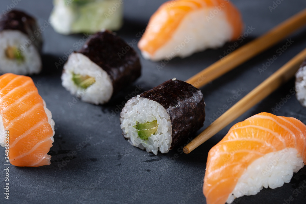 Fresh seafood sushi meal on darck background