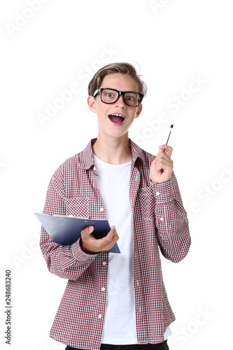 Cute teenager with clipboard on white background