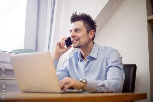 Young businessman using mob...