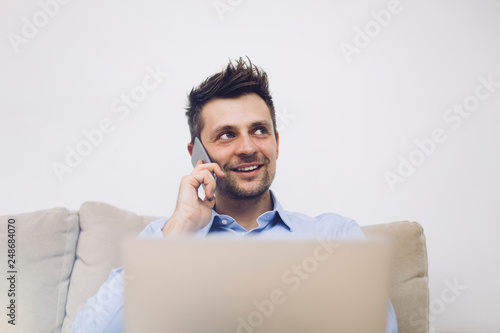 Young businessman using mob...
