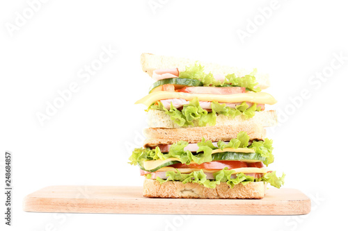 Tasty sandwiches with cutting board isolated on white background