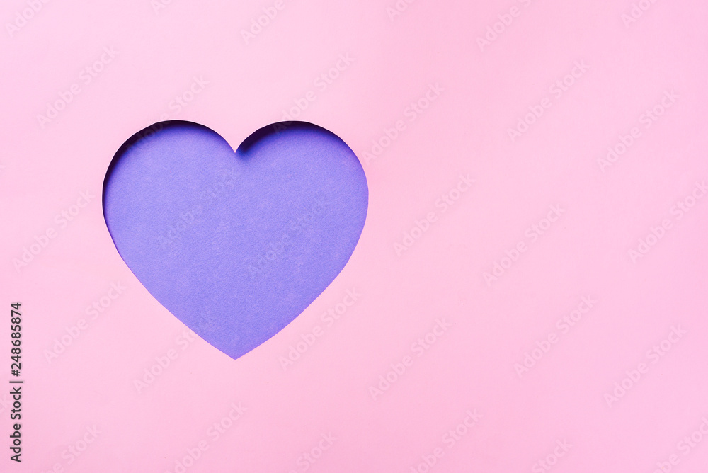 Valentines day card. Cutted heart in punchy pastel paper background. Minimalist concept. Love, date, romantic concept.
