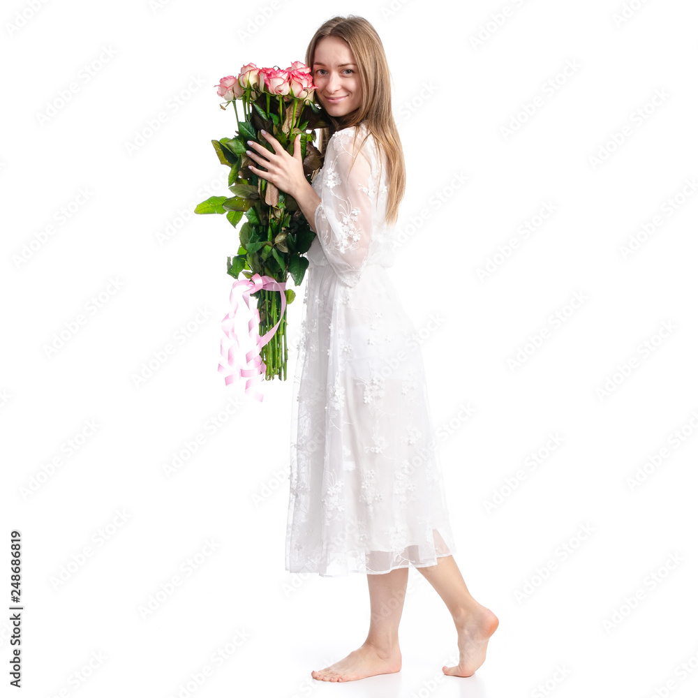 Woman in dress with flowers roses in hand on white background isolation